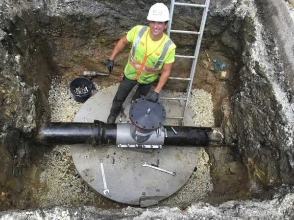 A man standing in the middle of a hole.